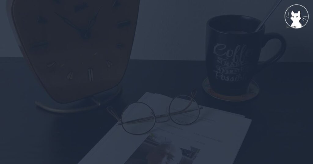 A desk with a clock, a pair of eyeglasses atop documents, and a coffee mug with motivational text sits on a coaster—as if inviting writing through grief or crafting a bilingual elegy in the quiet morning light.