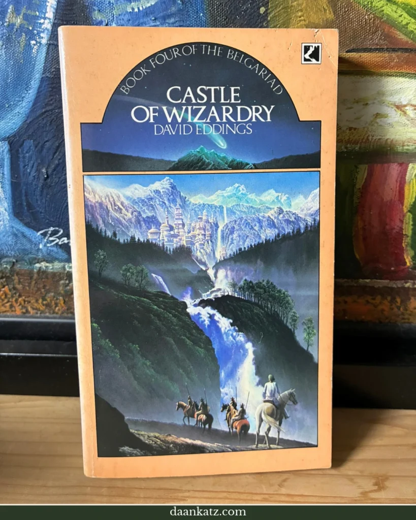 Fantasy Novel 'Castle of Wizardry' displayed on a wooden nightstand