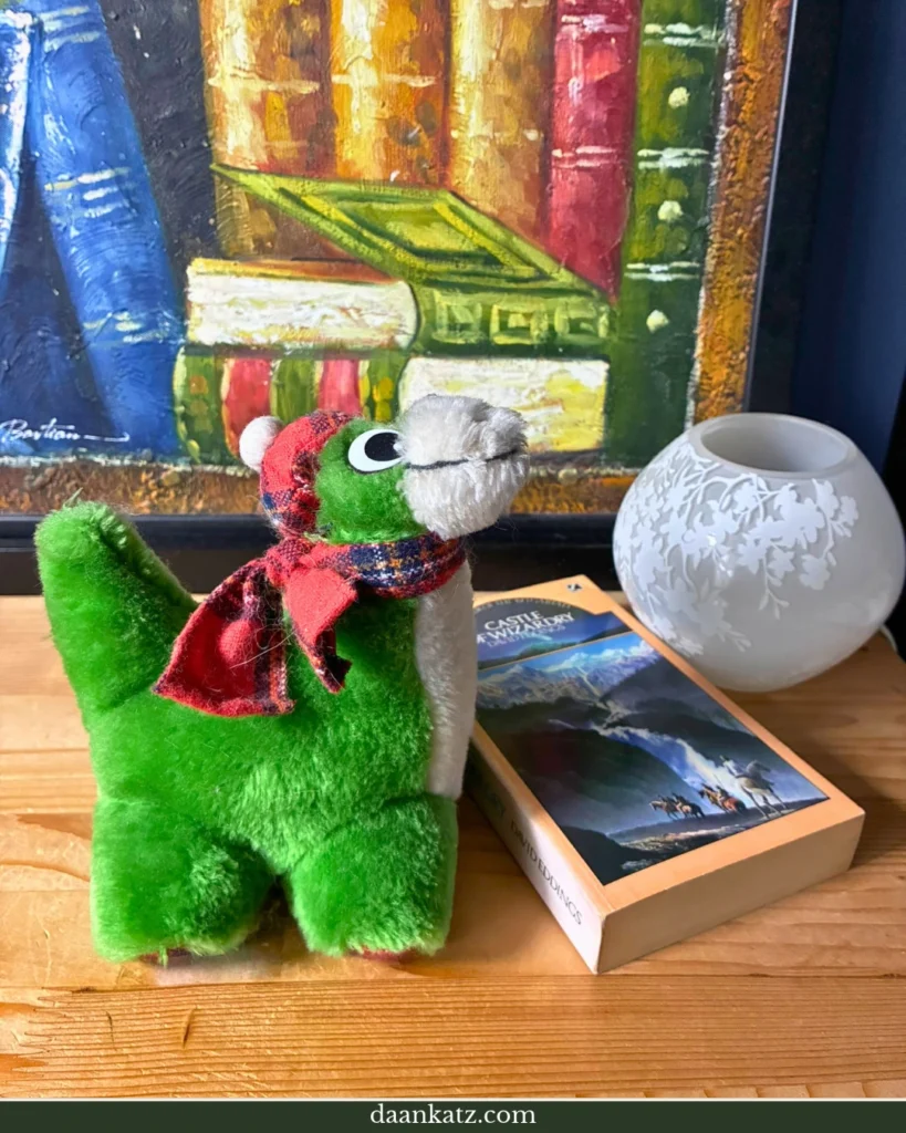 Nessie soft toy and fantasy novel 'Castle of Wizardry'
